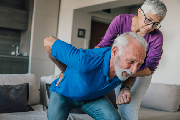 istock Woman helping husband with backache 1067519934