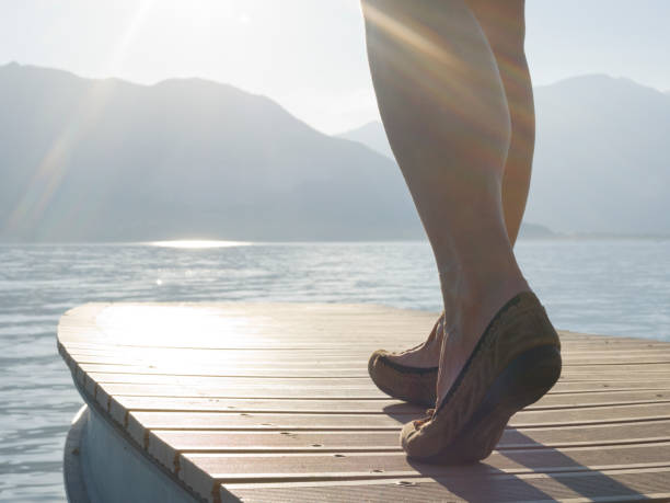 istock Close up of legs walking down dock 1067522826