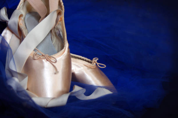 istock blush ballet Pointe shoes with blue tutu on black 1067523934