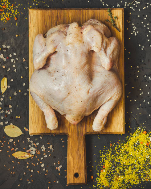 istock raw chicken - whole roasted chicken (chicken meat). Top view with copy space 1067524026