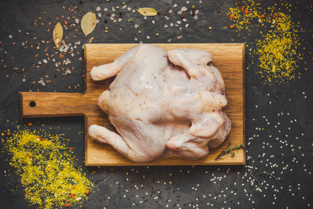 istock raw chicken - whole roasted chicken (chicken meat). Top view with copy space 1067524130