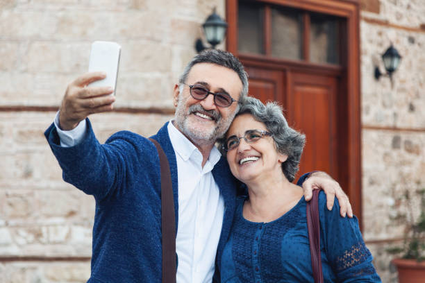 istock Tourist senior couple taking a selfie 1067529824