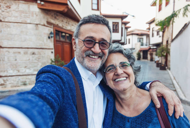 istock Tourist senior couple taking a selfie 1067529844