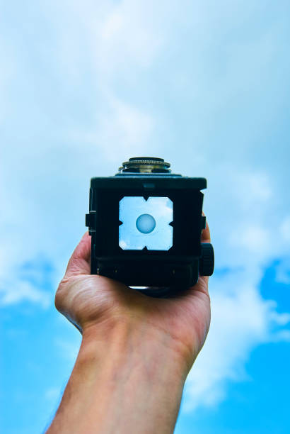 istock First person view through vintage TLR (Twin lens reflex) camera viewfinder. 1067531106