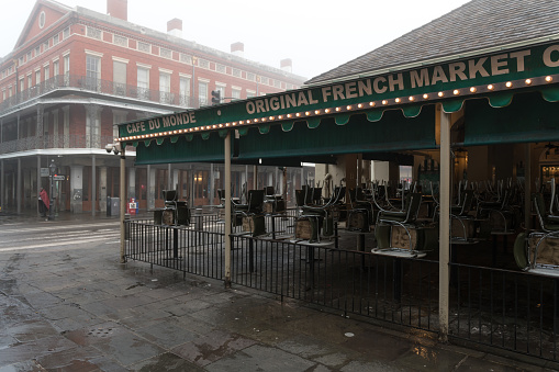 New Orleans, USA - Nov 7, 2018: The famous Cafe Du Monde early on a foggy morning. The cafe is famous for its fluffy Beignets and Chicory coffee.