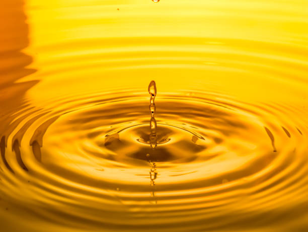 istock Close-Up Of Drop Falling In Water 1067539992