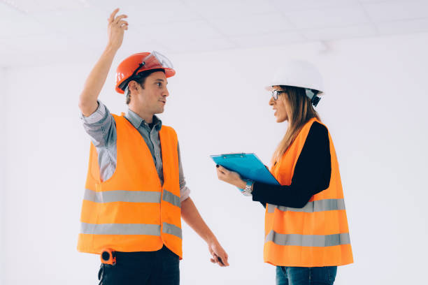 istock Architect Discussing With Colleague At Site 1067541598