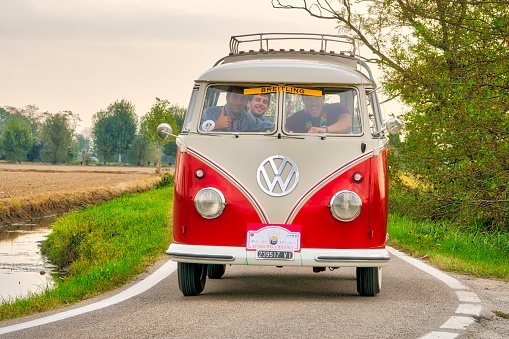 Milan / Italy - October 01, 2016: a vintage German Volkswagen Transporter van traveling on a rural road