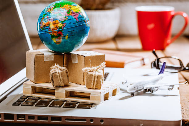 istock Close-Up Of Containers And Globe On Laptop 1067548458