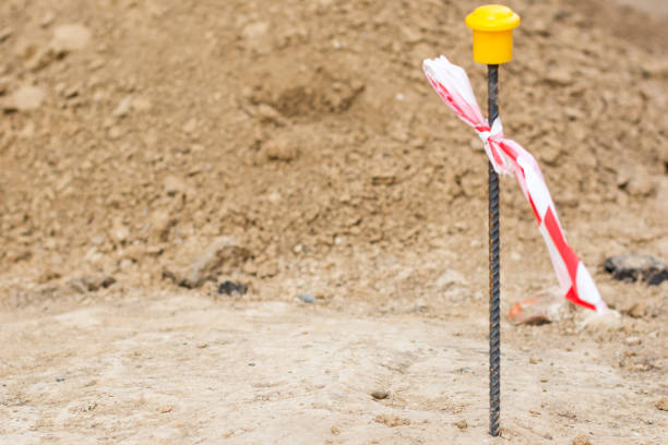 istock Separating stake on a background of brown ground. Archaeological excavations 1067550298