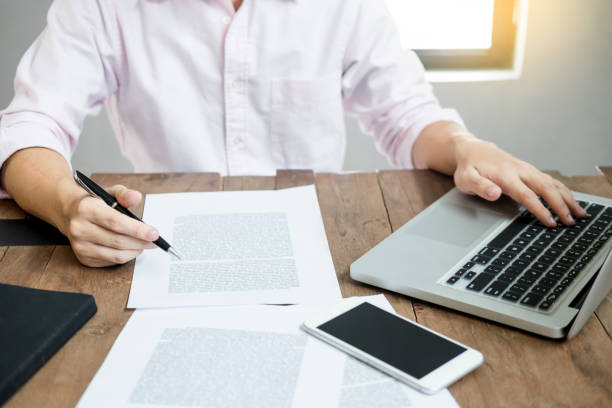 istock Midsection Of Businessman Working On Laptop In Office 1067554580