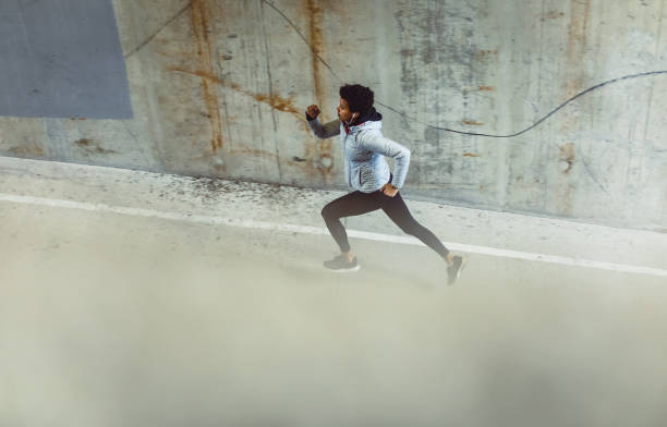 istock Young Woman Running on The Streets 1067559740