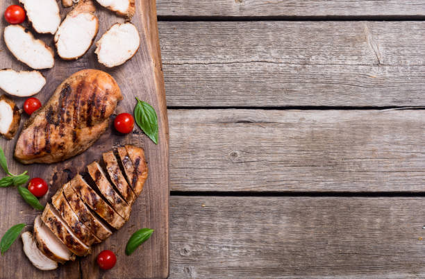 istock Grilled chicken breast ( fillet ) with basil and tomatoes 1067566036