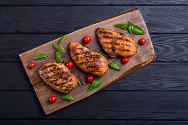 istock Grilled chicken breast ( fillet ) with basil and tomatoes 1067566044