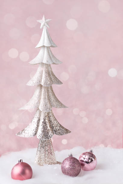istock silver christmas tree and baubles in snow 1067570870