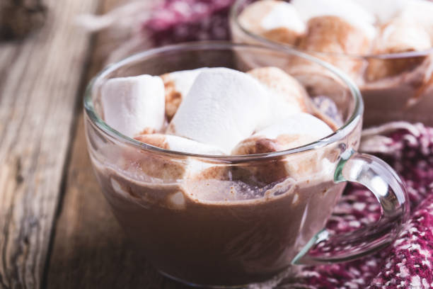 istock Frothy hot chocolate in glass mugs with marshmallows 1067570992
