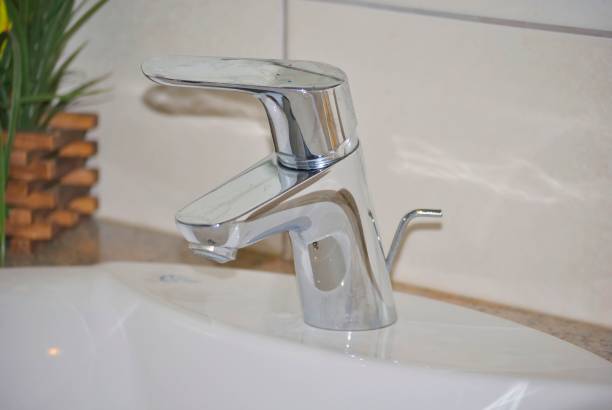 istock Metal faucet in a bathroom 1067571584