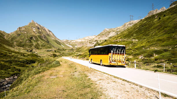 Postbus on the way over the Nufenen Pass, connection from the canton of Valais and Ticino, Switzerland stock photo
