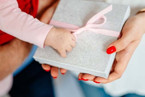 Woman giving box with ribbon surprise gift. Christmas present gift