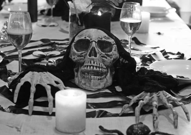 istock halloween, decoration and scary table set up 1067584268