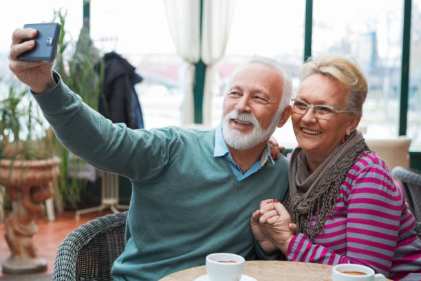 istock Senior couple taking selfie 1067600870