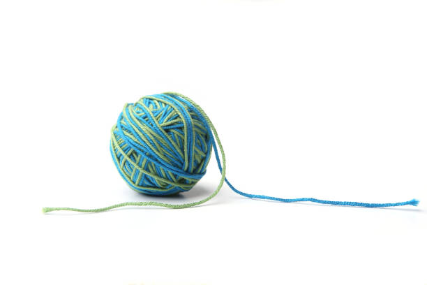 istock Colorful cotton thread ball from two color green and blue thread  isolated on white background. 1067602760