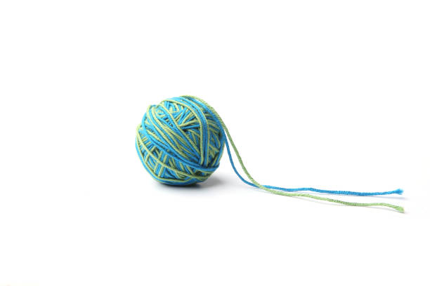 istock Colorful cotton thread ball from two color green and blue thread  isolated on white background. 1067602780