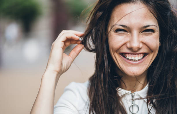 istock Woman with messy hair laughing 1067607916