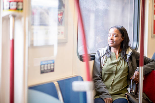 istock Smiling Woman On Bus 1067612436
