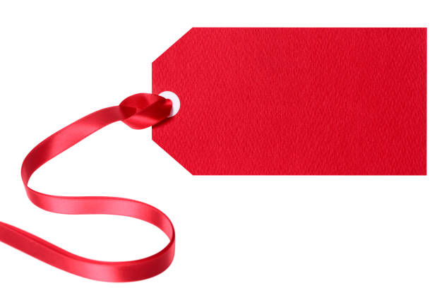 istock Red gift tag or label with ribbon isolated on white background 1067617402
