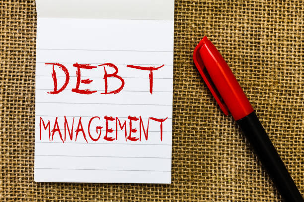 istock Handwriting text Debt Management. Concept meaning The formal agreement between a debtor and a creditor 1067623216