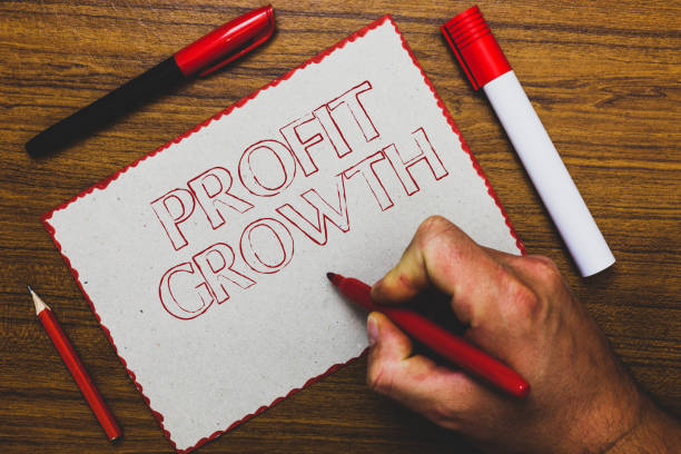 istock Word writing text Profit Growth. Business concept for Objectives Interrelation of Overall Sales Market Shares Man hand holding marker notebook paper expressing ideas wooden background. 1067623718