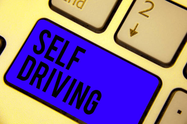istock Handwriting text Self Driving. Concept meaning Autonomous vehicle Ability to navigate without human input Keyboard blue key Intention create computer computing reflection document. 1067623802