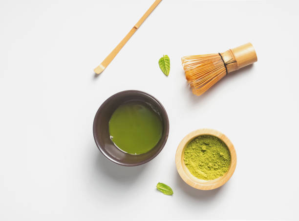 istock Matcha tea in a traditional bowl, whisk and powder 1067628270