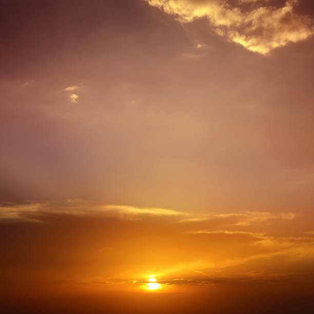 istock cloudscape of colorful sunset sky with shining sun 1067633594