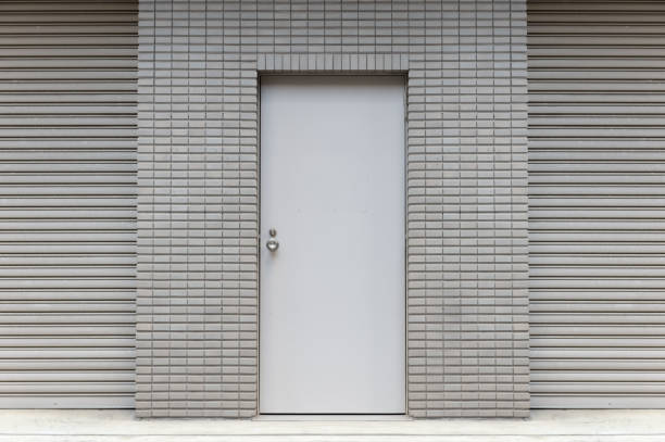 istock sidewalk by street wall & door 1067635678