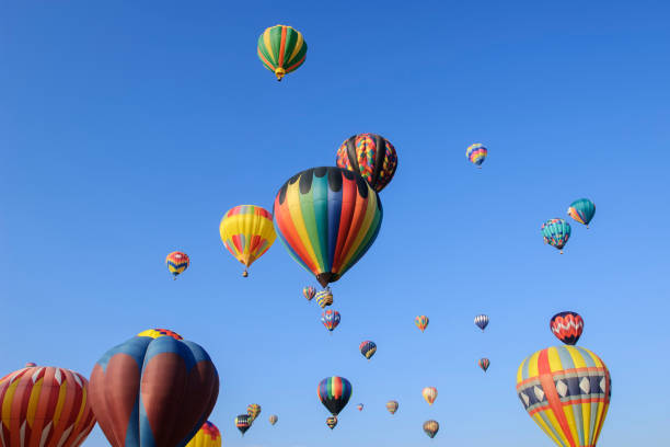 istock Hot Air Balloons Ascending Into Cloudy Sky 1067637838