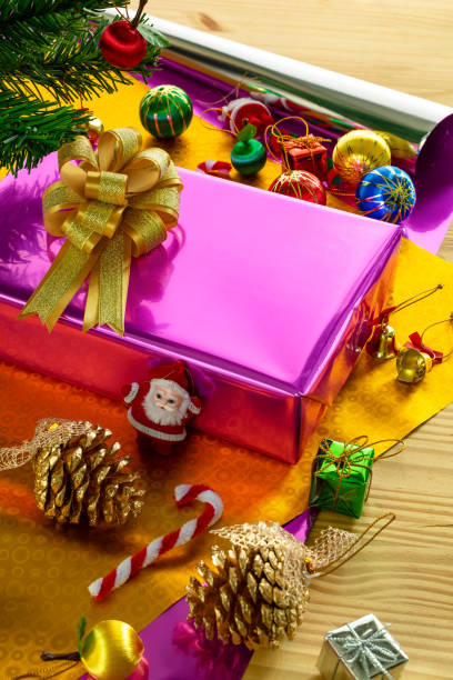 istock Gift box with bow on top and Christmas tree decoration items 1067638942