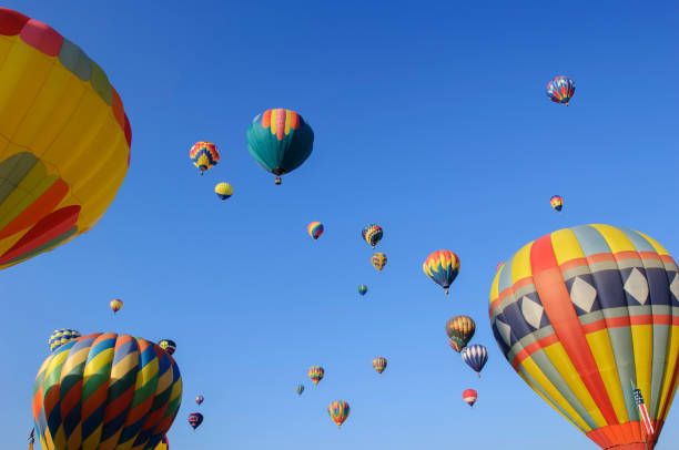 istock Hot Air Balloons Ascending Into Cloudy Sky 1067638992