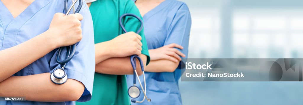 Doctor working in hospital with other doctors. Healthcare people group. Professional doctor working in hospital office or clinic with other doctors, nurse and surgeon. Medical technology research institute and doctor staff service concept. Nurse Stock Photo