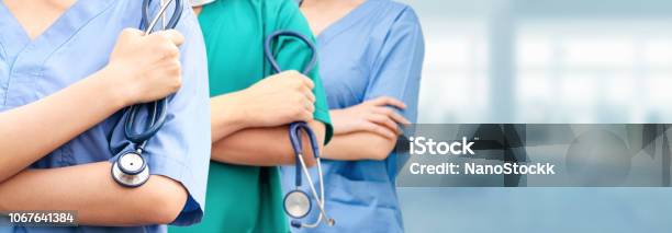 Doctor Working In Hospital With Other Doctors Stock Photo - Download Image Now - Nurse, Group Of People, Doctor