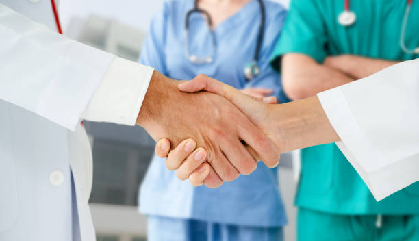 istock Doctor working in hospital with other doctors. 1067642546