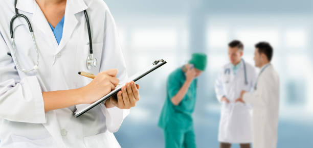 istock Doctor working in hospital with other doctors. 1067650714