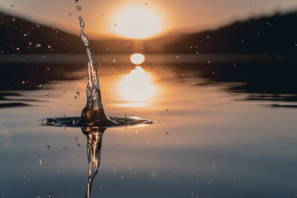 istock Colored water drop with beautiful sunrise 1067653034