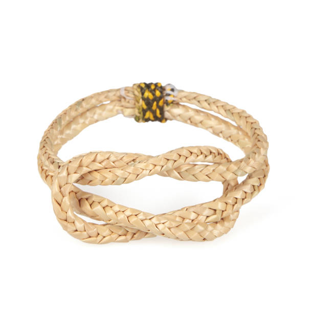 wristband made from woven straw on a white background