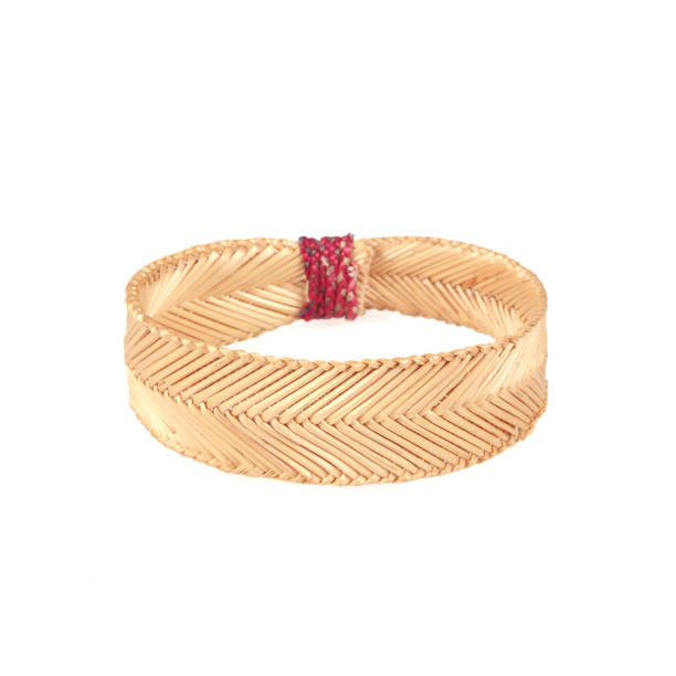 istock wristband made from woven straw on a white background 1067659064