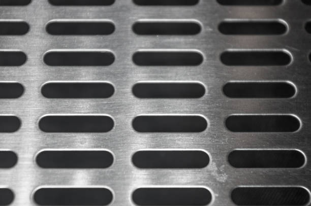 istock stainless steel grating with oblong holes, close-up 1067659334