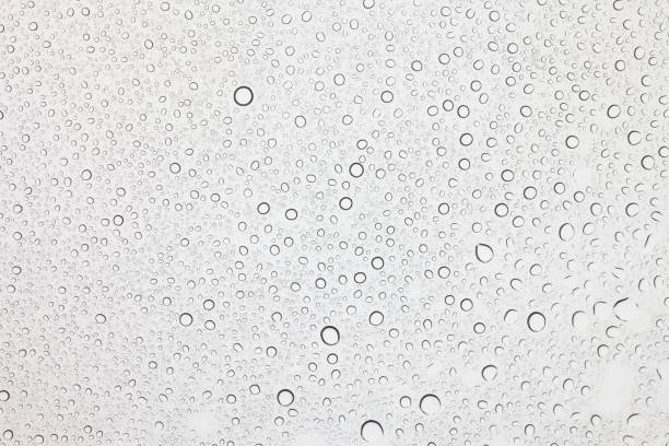 istock Rain droplets on glass background, Water drops on glass. 1067661060
