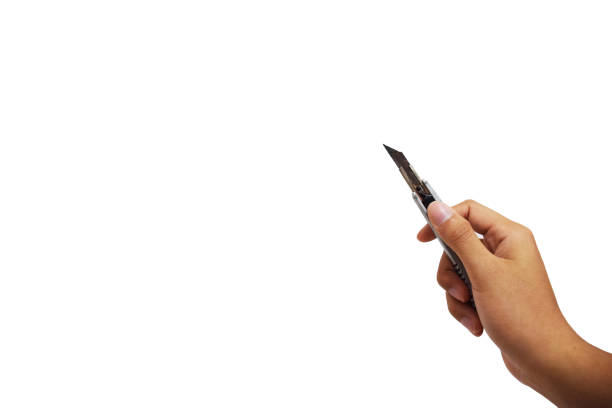 istock male hand holding a rusty cutter that open the blade with isolated background and copy space 1067661100