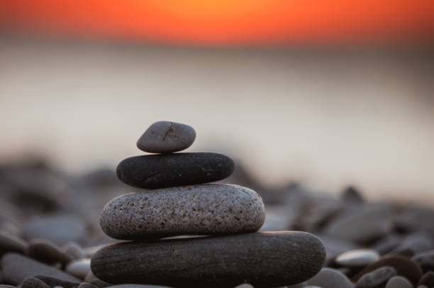 istock stack of zen stones on pebble beach 1067661174